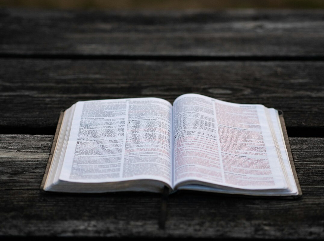 Open book on a table with pages turned