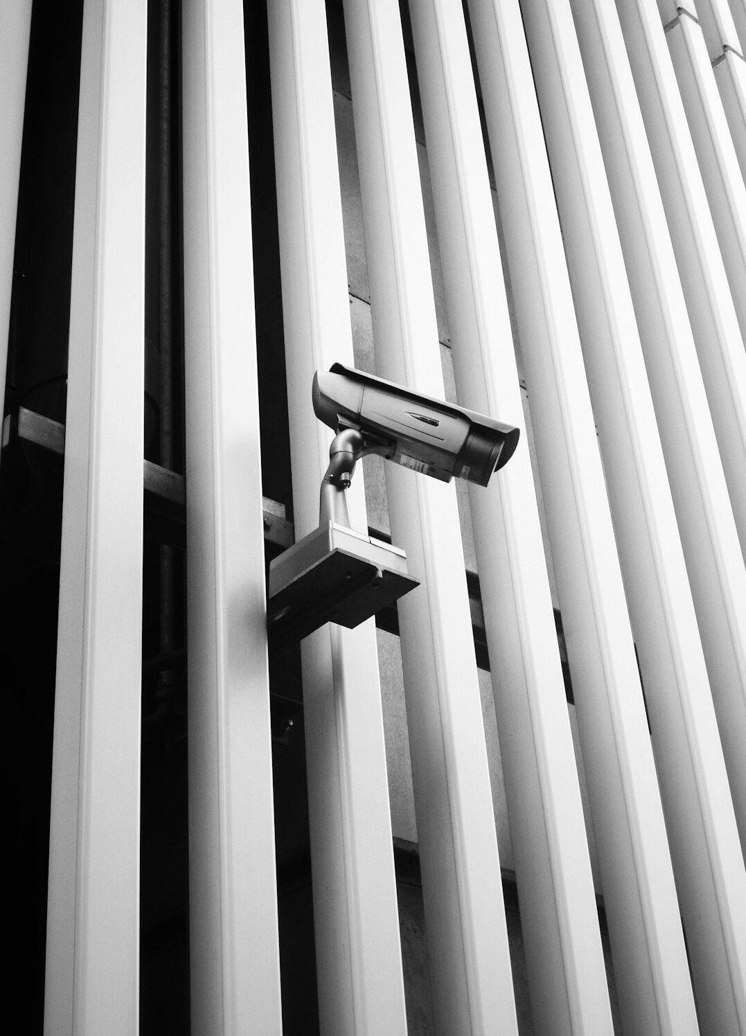 store security guard monitoring cameras