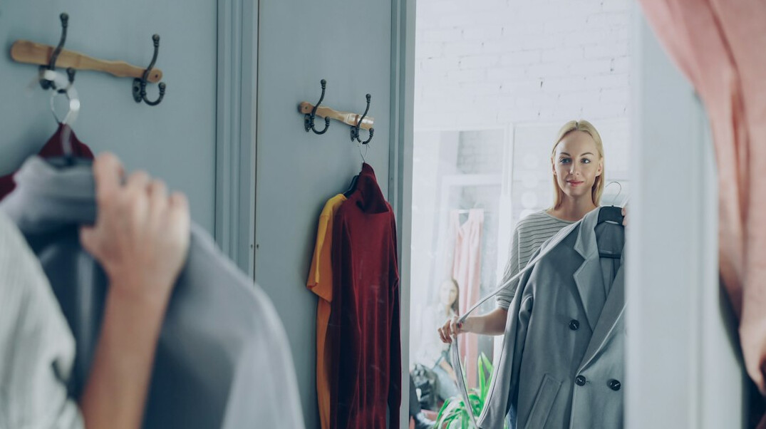 woman trying clothes in fitting room
