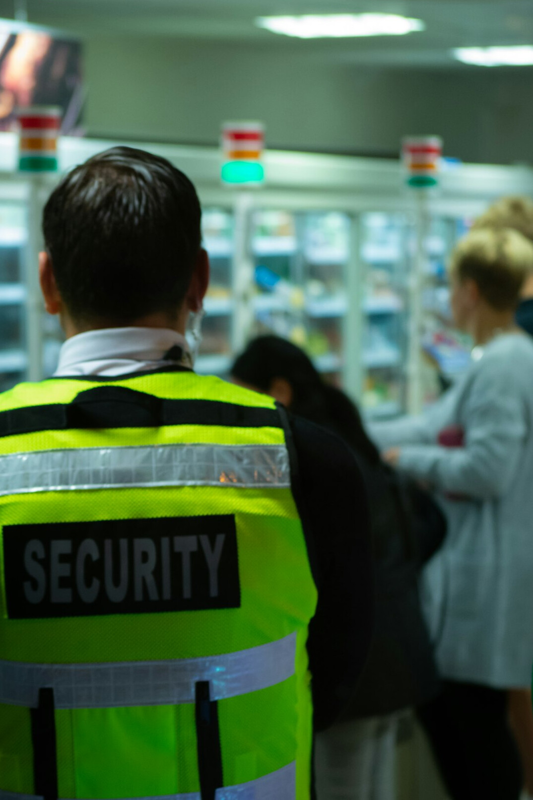 store detective monitoring customers