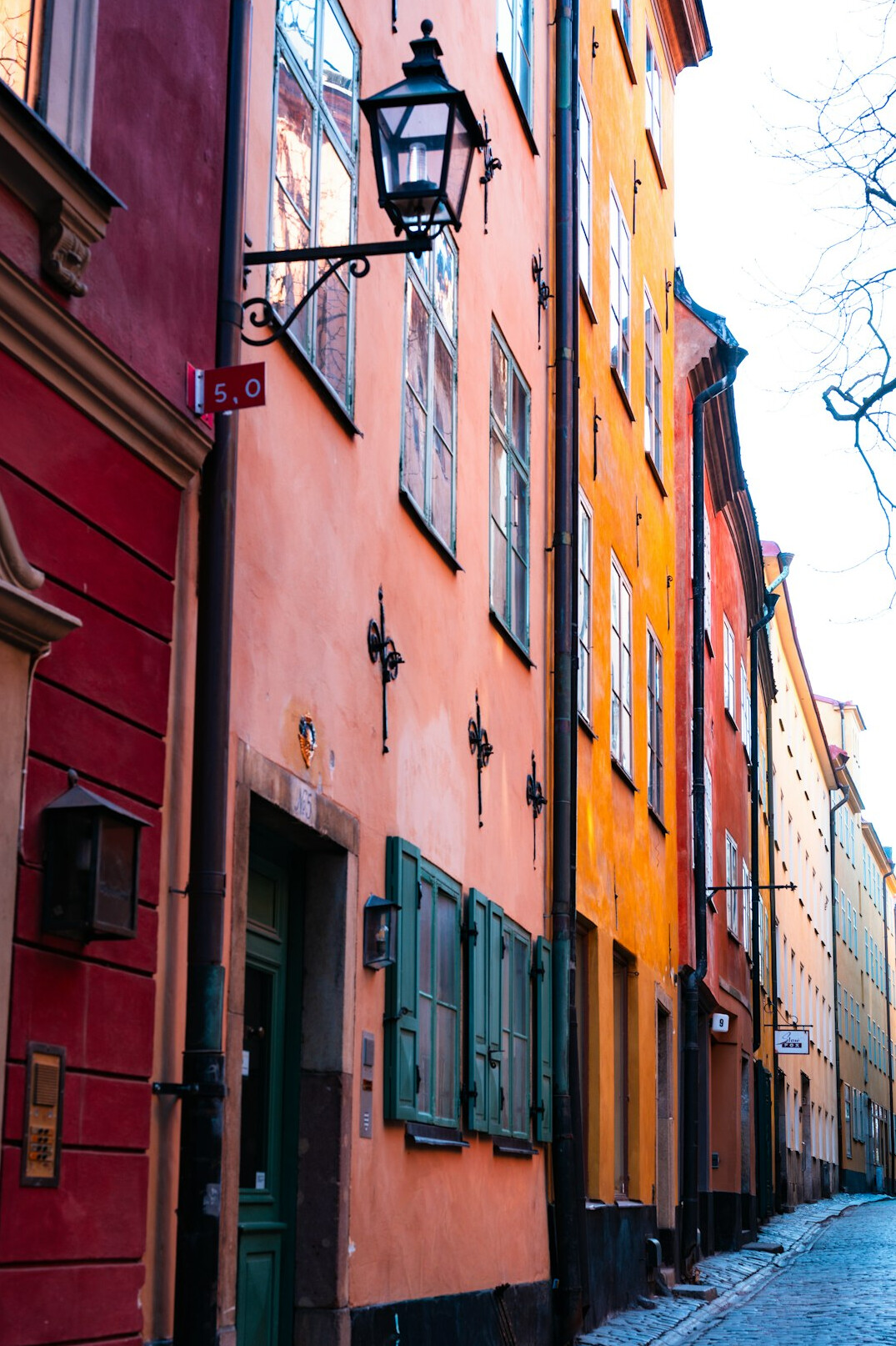 Historic european old town street with colorful tenement houses